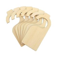 six wooden cutting boards with different shapes and sizes