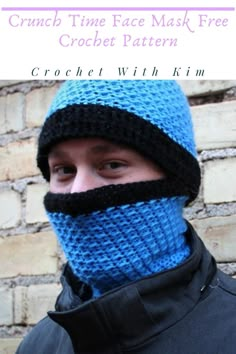 a man wearing a blue and black crochet face mask