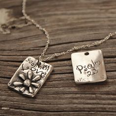 "This sweet rectangular shaped pendant with a whimsical raised daisy reads \"goodness\" and \"Love\"; Psalm 23 is written on the back. It measures 3/4\" long by 5/8\" wide. Available as a Pendant Only or on an 18\" cable chain with beads. Choose from the drop down menu under \"Style - select a style\" to specify your choice. Solid Sterling Silver Jewelry, Unique Christian, Handmade in Texas by artist Shandon Camarillo-Whitson Solid Sterling Silver Jewelry, Unique Christian, Handmade in Texas by Inspirational Personalized Rectangular Jewelry, Logo Jewelry, Fish Jewelry, Divine Guidance, Love Pendant, Jewelry Making Necklace, Psalm 23, Silver Jewelry Handmade, Jewelry Unique