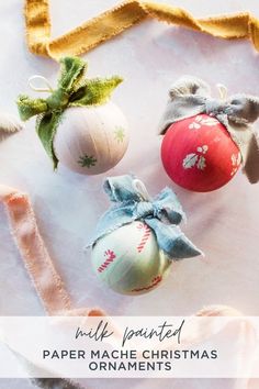 three ornaments with bows on them and the text will be printed paper mache christmas ornaments