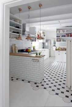 the instagram page shows an image of a kitchen with black and white flooring