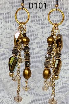 This is a one-of-kind handmade beautiful glass beads and gold chain earring Festive Gold Beaded Chandelier Earrings, Gold Beaded Earrings With Dangling Beads As Gift, Gold Beaded Dangling Earrings As Gift, Elegant Beaded Earrings With Dangling Beads For Festive Occasions, Gold Dangle Beaded Earrings For Party, Festive Gold Earrings With Gold Beads, Gold Earrings With Beads For Celebration, Elegant Gold Beaded Dangle Earrings, Elegant Gold Dangle Beaded Earrings