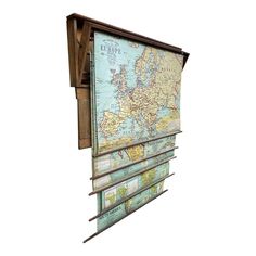 an old world map hanging on the side of a wooden wall mounted mailbox,