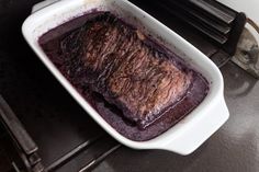 a pan filled with food sitting on top of a stove