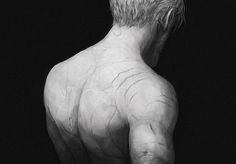 a black and white photo of a man's back