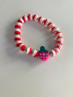 this is a silly strawberry bracelet that will look good with anyone. it will make everyone be amazed by you! 🍓 ❤️ Strawberry Clay Bead Bracelet, Strawberry Friendship Bracelet, Fun Red Bracelet Gift, Fun Red Bracelet For Gift, Playful Pink Jewelry With Fruit Design, Cute Red Stretch Bracelet, Cute Pink Jewelry With Strawberry Print, Cute Pink Strawberry Print Jewelry, Strawberry Bracelet