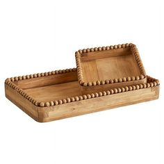 two wooden trays sitting on top of each other with beaded trim around the edges