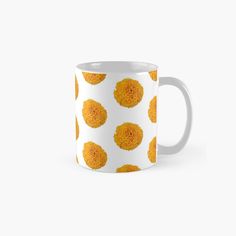 an orange flower pattern on a white background classic mug