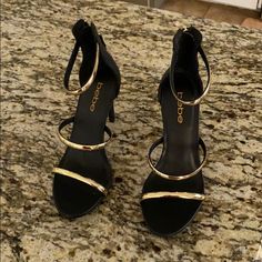 Black Stiletto Heels With Gold Accent. Never Worn. Black Heels With Gold Accent, Black Gold Shoes, Black And Gold High Heels, Black Dress With Gold Heels, Black Gold Heels, Gold Heels Prom, Black And Gold Heels, Black And Gold Shoes, Strapy Heels