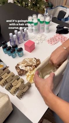 a person is making something out of some kind of fabric and it's organized with hair clips