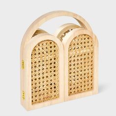 a wooden radio that is made out of wood and has holes in the front side