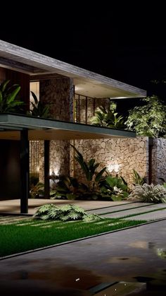 an exterior view of a modern house at night