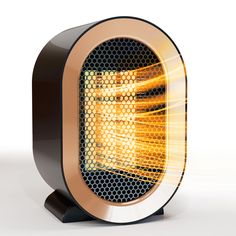 a black and gold heater sitting on top of a table