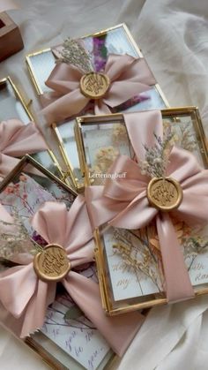 four small cards with pink bows on them