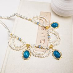 Material: Alloy Color: Multi-Layer Lotus, Small Lotus Fashion Element: Tassel, Chain Style: Antique Style Handmade Elegant Alloy Necklaces, Elegant Handmade Alloy Necklaces, Handmade Dangle Necklace In Alloy, Handmade Alloy Dangle Necklace, Handmade Dangle Alloy Necklace, Elegant Blue Alloy Necklace, Ancient Necklace, Chinese Hanfu, Pearl Necklaces