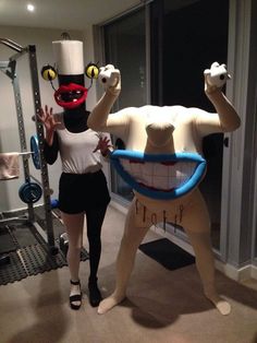 two people in costumes standing next to each other