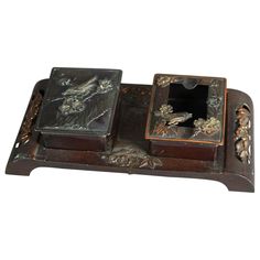 two wooden boxes with carvings on them