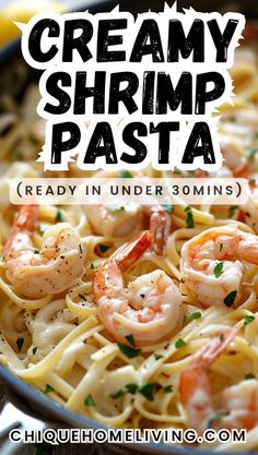 creamy shrimp pasta in a skillet with lemons and parsley on the side