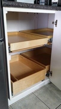 an open refrigerator with drawers in it