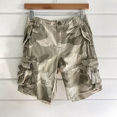 Gap Kids Superlastic Boy's Green Camo Adjustable Waist Cargo Shorts Size 7 Husky Nwt Brand: Gap Kids Department: Boys Size: 7 Husky Color: Army Green Style: Cargo Shorts Fit: Loose Rise: Mid-Rise Closure: Zipper Fly/Button Pattern: Camouflage Material: 100% Cotton Condition: New With Tags Fearures: - Front Vertical Flap Pockets With Snap Button Closure - Side Cargo Pockets With Onseam Mini Flap Pocket - Back Flap Pockets With Velcro Clorure - Zip Fly With Button Closure - Adjustable Waist - Belt Style Cargo Shorts, Gap Denim Shorts, Long Denim Shorts, Gap Kids Boys, Boys Cargo Shorts, Camouflage Shorts, Dressy Shorts, Chambray Shorts, Denim Flowers