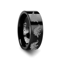 a black ring with white dragon engraving on the side and an inscription that says, i love