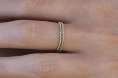 The delicate ring composed of a simple ring and a twisted ring, ideal for guitarist. ✨ Available in three colors. The width of the rope may vary very slightly depending on my stocks. ✨ Don't hesitate to ask for your size if you can't find it in the drop-down menu, I can make any ring to order :) 🖋️ The ring is delivered on a pretty magnetic wooden plaque to store it. You can personalize the wooden plaque with an engraving, this must be specified when ordering. ✨ Everything is presented in a pre Minimalist Adjustable Twisted Rings, String Rings, Guitar String Jewelry, Twisted Ring, Simple Ring, Twist Ring, Gold Logo, Delicate Rings, Rings Simple