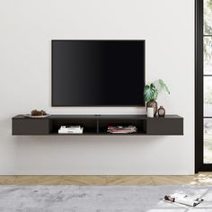 PRICES MAY VARY. 【Modern Floating TV Stand】 Made of solid MDF board with rich black finish which make the floating media stand beautiful, waterproof, wear-resistant and easy to clean. It is worth mentioning that wall mount tv stand frees up from floor, greatly expand floor space and suitable for small room. 【Wire Management System】The floating tv stand features cable holes, it is designed for hiding messy cables, and convenient for clients to use electronic equipment. This item is suitable for living room, bedroom or reception room. It will be a great addition to your room. 【Large Storage Space】 Our 70 inch media console has wide tabletop and extra storage space on both sides, it can provide large storage capacity to meet needs of modern home. The TV Stand is large enough to accommodate TV Tv Floating Shelf, Mounted Tv Decor, Mounted Entertainment Center, Mount Tv Stand, 75 Inch Tv, Wall Mount Entertainment Center, Wall Mount Tv, Entertainment Center With Storage, Wall Mount Tv Stand