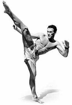 a man doing a handstand in front of a white background