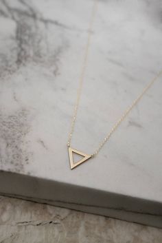 Tiny Gold Triangle Charm Necklace 9K 14K 18K Gold Necklace | Etsy Minimalist Geometric Jewelry In 14k Gold, Minimalist 14k Gold Geometric Jewelry, Minimalist Geometric 14k Gold Jewelry, Minimalist Sterling Silver Triangle Necklace, Minimalist Gold Triangle Jewelry, Minimalist Triangle Gold Jewelry, Minimalist Triangle-shaped Jewelry For Gifts, Minimalist Triangle Jewelry For Gifts, Minimalist Geometric Necklaces For Everyday