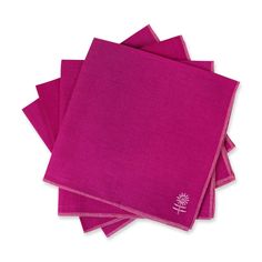 four pink napkins stacked on top of each other