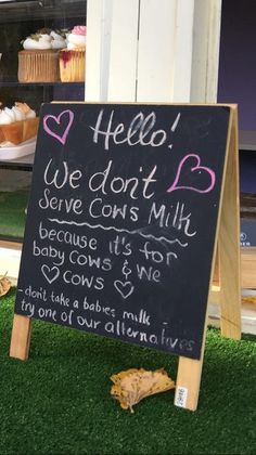 a chalkboard sign that says hello, we don't serve cow milk because it's not baby cows