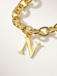 Remember Me Bracelet | Gold N | Product Detail Image | Uncommon James Adjustable Bracelet With Letter Print For Everyday, Elegant Gold Charm Bracelet With Initials, Personalized Gold Charm Bracelet With Initials, Adjustable Gold Letter Bracelet, Adjustable Letter-shaped Gold Bracelet, Be Unforgettable, Gold-tone Jewelry With Adjustable Chain And Initial Pendant, Initial Bracelet Gold, Uncommon James