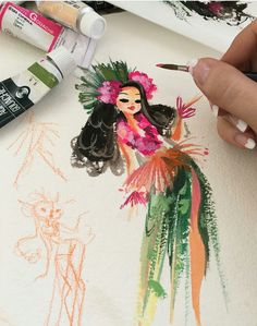 someone is drawing with markers and watercolors on paper