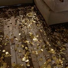 the floor is littered with gold coins and confetti scattered on top of it