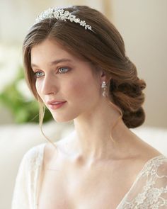 a woman wearing a bridal head piece