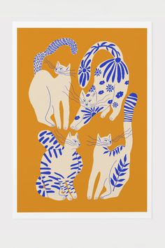 two cats are playing with each other in front of an orange background that has blue and white designs on it