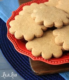 some cookies are sitting on a red plate