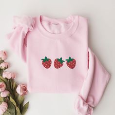 Strawberry Sweatshirt, Embroidered Strawberry Crewneck Sweatshirt, Strawberries Shirt, Cute Embroidered Sweatshirt, Berry Embroidered Shirt This embroidered strawberry crewneck sweatshirt is everything. Perfect to show your love for strawberries! Please let me know if you would like extended sizing (3X-5X), I have certain color and size options available! ✨ 50% cotton, 50% polyester ✨ Pre-shrunk ✨ Classic fit Care: Machine wash: warm (max 40C or 105F) Tumble dry: low Sweet Long Sleeve Cotton Sweatshirt, Pink Long Sleeve Sweatshirt With Machine Embroidery, Pink Long Sleeve Sweatshirt With Embroidery, Casual Pink Sweatshirt With Machine Embroidery, Casual Pink Sweatshirt With Floral Embroidery, Cute Long Sleeve Embroidered T-shirt, Long Sleeve Cotton Tops With Strawberry Print, Pink Long Sleeve Embroidered T-shirt, Pink Embroidered Long Sleeve T-shirt