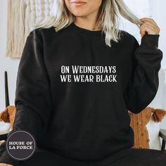 "\"On Wednesdays We Wear Black\" Adult Sweatshirt This soft sweatshirt has a loose fit for a comfortable feel. :: SIZING :: - This trim-blend sweatshirt fits true to size, if you are in between sizes, we recommend sizing up - Please check out our size chart for measurements to ensure an accurate fit - No exchanges/returns for wrong size orders :: WASHING INSTRUCTIONS :: - Turn garment inside out and wash cold. - Tumble dry on low temperature setting. - Do not iron directly on the print. ::GARMEN Edgy Black Halloween Sweatshirt, Black Punk Sweatshirt With Letter Print, Black Punk T-shirt For Winter, Black Punk Style Sweatshirt For Halloween, Black Punk Style Halloween Sweatshirt, Black Punk Sweatshirt For Halloween, Black Halloween Punk Sweatshirt, Black Band Merch Sweatshirt For Fall, Black Cotton Punk Style Sweatshirt