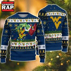 NCAA West Virginia Mountaineers Grinch Hand Ugly Christmas Sweater Get ready to show off your school spirit this holiday season with the NCAA West Virginia Mountaineers Grinch Hand Ugly Christmas Sweater. This fun and festive piece of apparel is perfect for fans looking to blend their love for college sports with the cheerful spirit of Christmas. Featuring a unique Grinch hand design prominently displayed against a backdrop that celebrates the West Virginia Mountaineers, this ugly Christmas swea Pittsburgh Panthers, 3d Sweater, Nfl Detroit Lions, Christmas Ugly Sweater, West Virginia Mountaineer, Holiday Attire, Autumn Days, Funny Xmas, Los Angeles Chargers