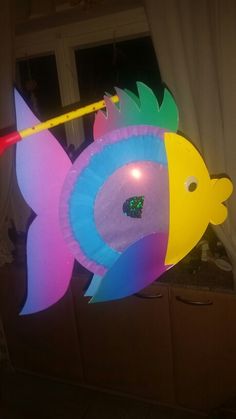 a balloon shaped like a fish with lights on it