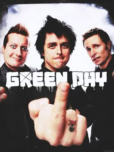 two men pointing at the camera with one finger in front of them and the words green day written on it