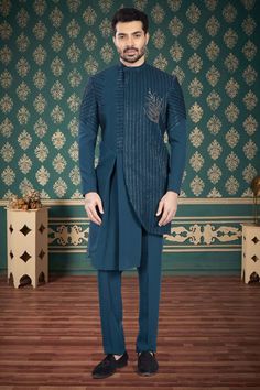 This sherwani, with its intricate cutdana embroidery, adds a touch of uniqueness to any sangeet or reception night. Stand out in style and elevate your look with this R14-S53 mens sherwani. Designer Nehru Jacket For Eid Reception, Designer Resham Embroidery Kurta For Reception, Designer Bandhgala For Reception Diwali Festival, Designer Bandhgala For Diwali Reception, Designer Straight Kurta For Reception, Designer Kurta For Reception And Transitional Seasons, Designer Kurta With Zari Work For Reception, Designer Zari Work Kurta For Reception, Designer Kurta For Eid Reception