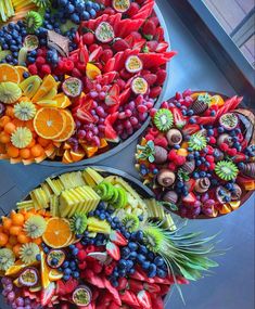 three trays filled with different types of fruit