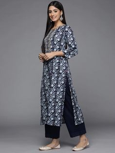 This is a single piece kurta. It comes with straight shape kurta comes with floral print detailing has round neck, 3/4th sleeves & calf length. Single Piece Color-Blue Suit Fabric-Cotton Work - Floral Print Detailing Neck-Round Neck Sleeves-3/4th Sleeves Kurta Length - Calf Length Washing Care - Hand Wash Size worn by the model: Small Height: 5'7" Festive Kurta With Printed Motifs And 3/4 Sleeves, Festive Kurta With 3/4 Sleeves And Printed Motifs, Festive 3/4 Sleeve Kurta With Printed Motifs, Eid Kurta With Floral Embroidery And 3/4 Sleeve, Festive Kurta With 3/4 Sleeves, Traditional Kurta With 3/4 Sleeves And Floral Embroidery, Traditional Kurta With Floral Embroidery And 3/4 Sleeves, Traditional Floral Embroidered Kurta With 3/4 Sleeves, Diwali Printed Straight Kurta