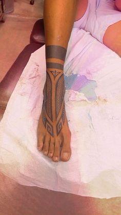 a person has a tattoo on their foot