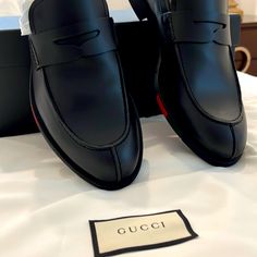 Black Gucci Loafers With Gucci Strips On The Side Of The Shoe. Very Elegant And Subtle Display Of Style. Never Worn, In Box With Original Papers. Luxury Business Tassel Loafers With Closed Toe, Luxury Tassel Loafers For Business With Closed Toe, Black Business Loafers With Flat Heel, Gucci Slip-on Formal Leather Shoes, Black Tassel Loafers With Rubber Sole In Calf Leather, Gucci Formal Slip-on Leather Shoes, Black Calf Leather Tassel Loafers With Rubber Sole, Black Tassel Loafers With Flat Heel For Business, Black Leather Luxury Tassel Loafers