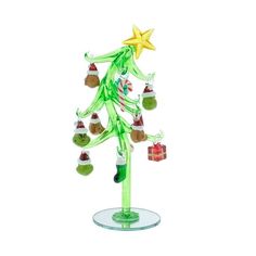 a glass christmas tree with ornaments on it