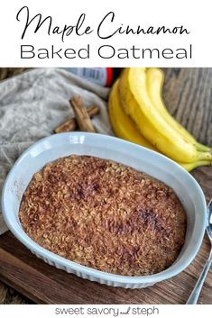 a baked oatmeal in a white dish next to bananas and cinnamon sticks