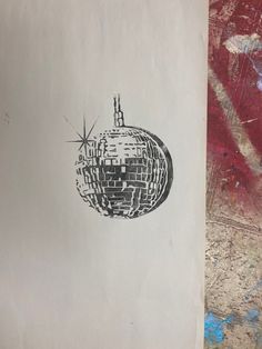 a piece of paper with a drawing of a disco ball on it